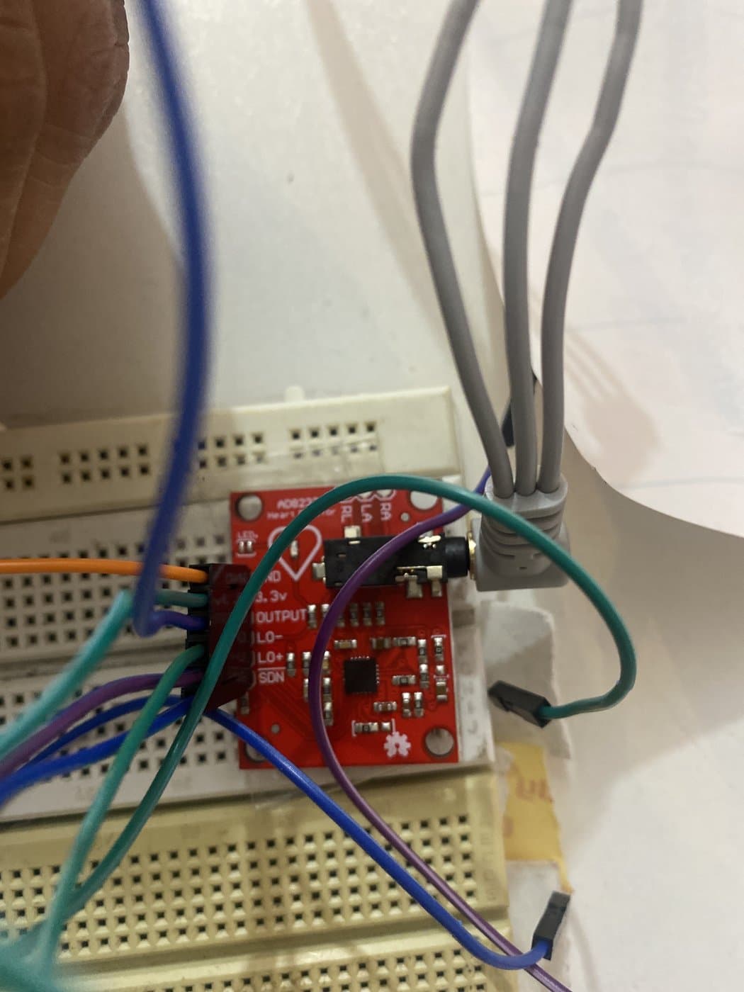 The AD8232 single-lead ECG breakout wired on the breadboard, with electrode leads plugged into its jack.